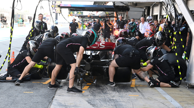 George Russell with his W14 in the pits
