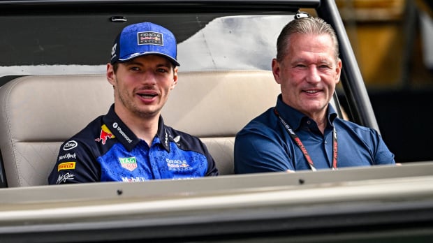 Max and Jos Verstappen sat in a boat together smiling after Max's retirement from Monaco GP — Photo: © IMAGO
