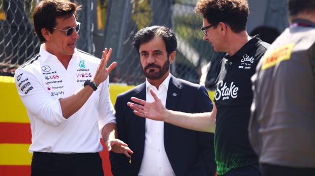 Toto Wolff, Mattia Binott, Mohammed Ben Sulayem in conversation walking down the paddock