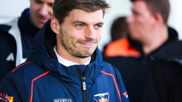 Verstappen smirking in a Verstappen.com jacket during his gt appearance at the Nurburgring