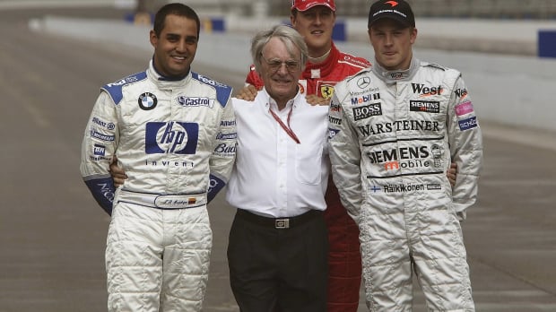 Michael Schumacher, Bernie Ecclestone, Kimi Raikkonen, Juan Pablo Montoya stand ahead of the 2003 US Grand Prix — Photo: © IMAGO