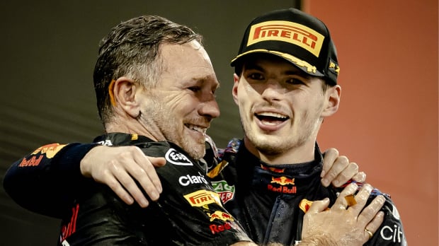 Christian Horner and Max Verstappen hug after winning the 2021 F1 drivers' title