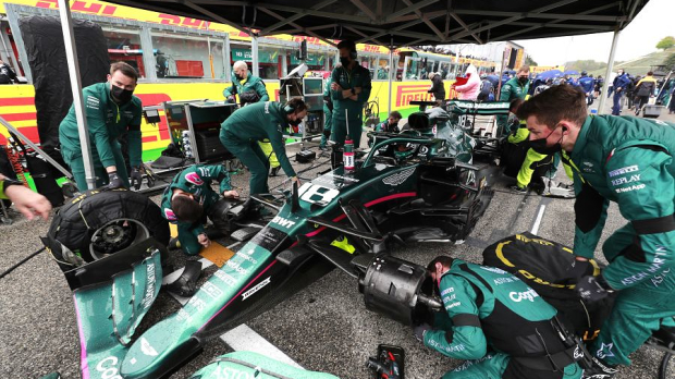 Lance Stroll's Aston Martin is repaired on the Imola grid