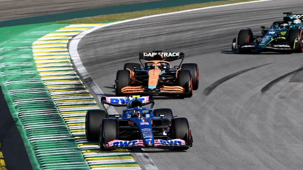 Esteban Ocon, Alpine A522, leads Daniel Ricciardo, McLaren MCL36, and Lance Stroll, Aston Martin AMR22