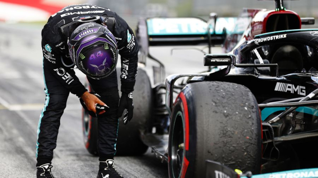 Lewis Hamilton inspects his Mercedes after the Styrian Grand Prix