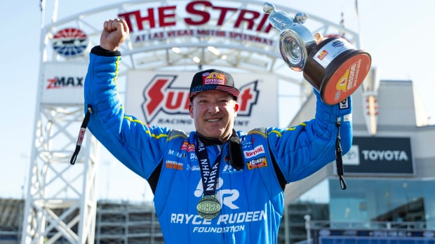 An image of NASCAR legend Tony Stewart celebrating an NHRA win
