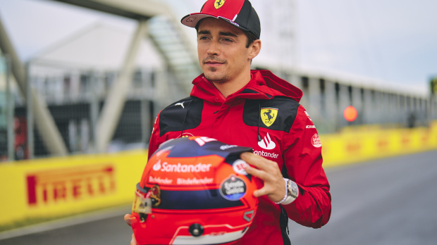 Charles Leclercs models his Gilles Villeneuve tribute helmet