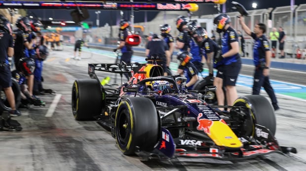Max Verstappen is serviced by his Red Bull mechanics in the pitlane