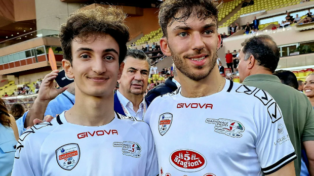 Gabriele Mini stands with Pierre Gasly