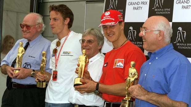 Sid Watkins, Jenson Button, Michael Schumacher and Murray Walker collect their 'Bernie' awards standing with Berne Ecclestone
