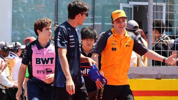 Colapinto, Tsunoda, Albon and Piastri walking in the F1 paddock