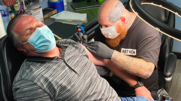 McLaren CEO Zak Brown gets a tattoo
