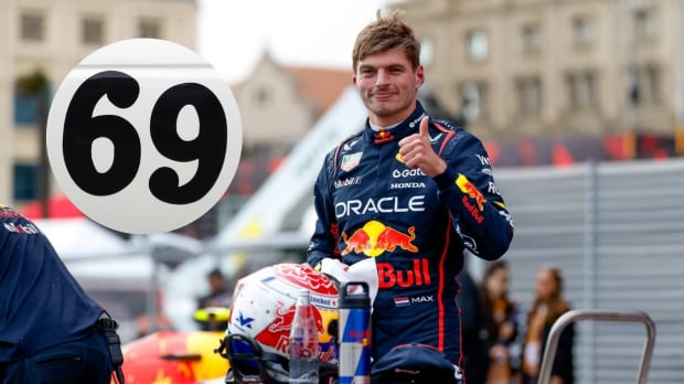 Max Verstappen gives a thumbs up and smiles with the number 69 inset