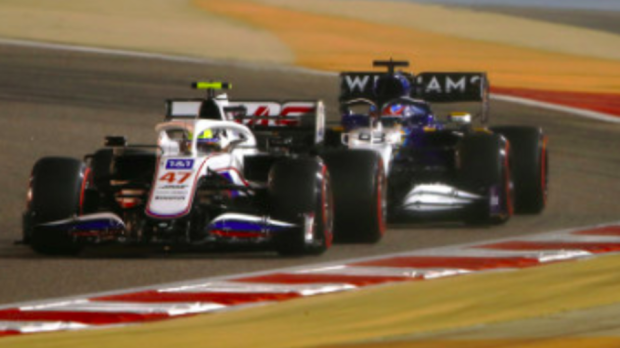 Haas driver Mick Schumacher battles with Williams' George Russell