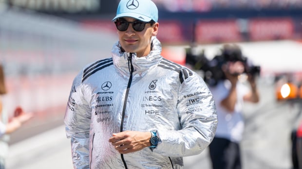 George Russell wears a big silver jacket ahead of the Austrian Grand Prix — Photo: © IMAGO