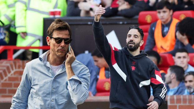 Manchester United manager Bruno Amorim beckons Toto Wolff over to him at Old Trafford