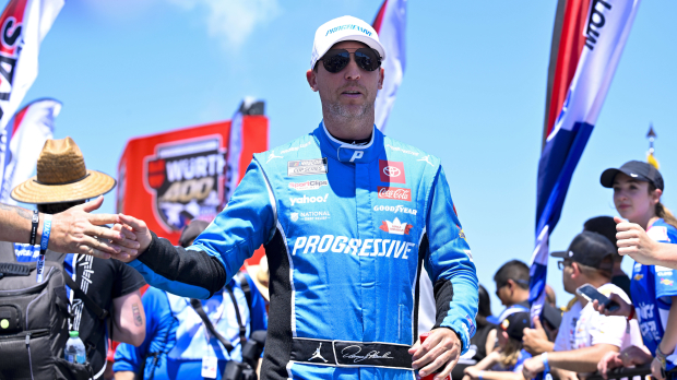 An image of NASCAR driver Denny Hamlin greeting fans