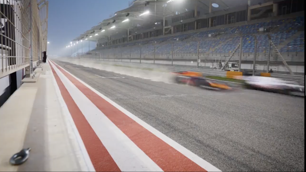 Verstappen racing past with another car