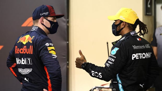 Max Verstappen and Lewis Hamilton chat after a grand prix