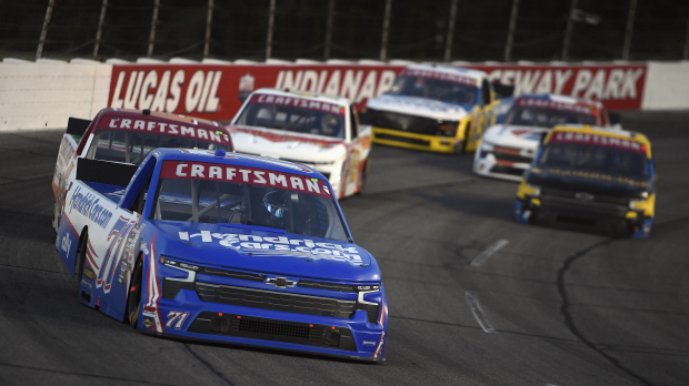 An image of a NASCAR Truck Series race at Indianapolis Raceway Park being led by Rajah Caruth