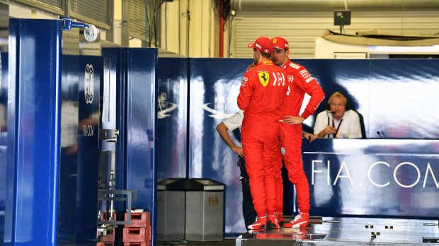 Leclerc and Sainz being weighed