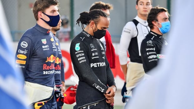 Max Verstappen and Lewis Hamilton standing