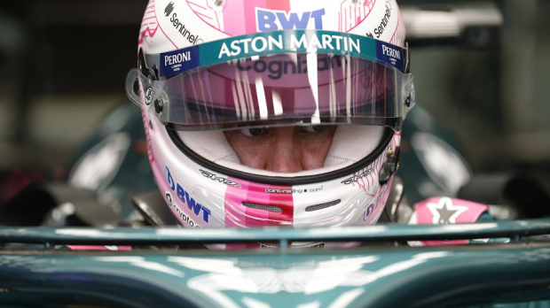 Sebastian Vettel settles into his Aston Martin