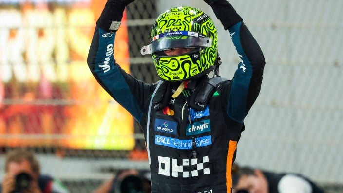 Lando Norris celebrating his F1 2025 drivers' championship win at the Abu Dhabi GP
