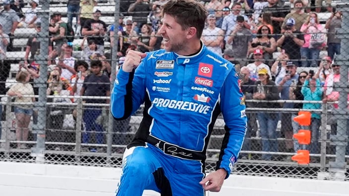 An image of Denny Hamlin celebrating a NASCAR victory