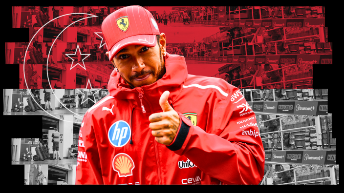 Hamilton giving a thumbs up in front of Singapore flag background