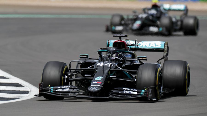 Hamilton survives late tyre puncture to claim seventh British GP win ...