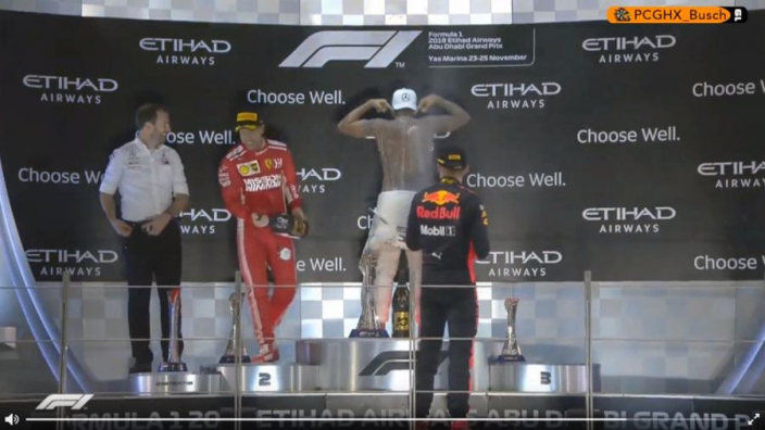 704px x 396px - VIDEO: Hamilton goes topless on Abu Dhabi podium! - GPFans.com
