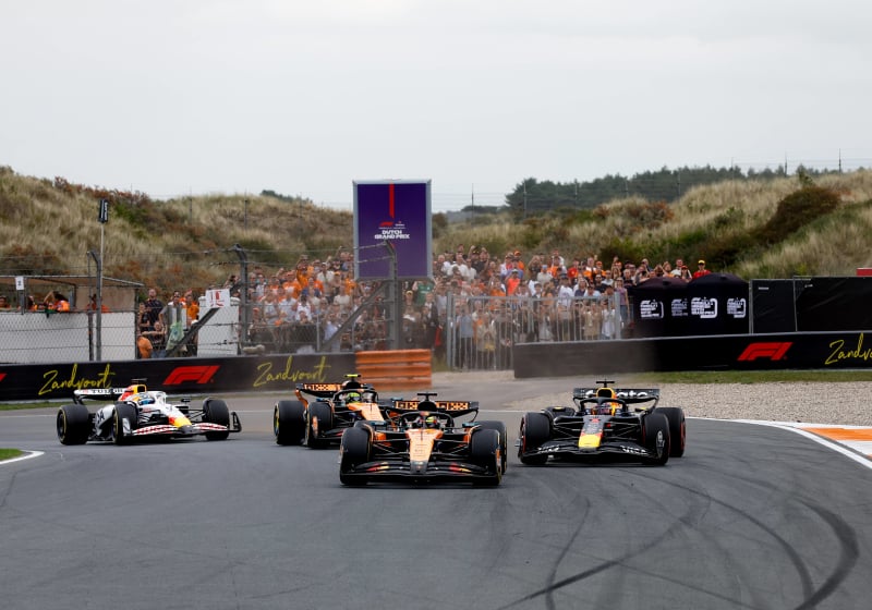 Verstappen drifting behind Piastri during opening lap at Zandvoort