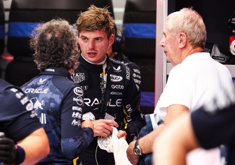Verstappen, Mekies and Marko discussing in Red Bull garage
