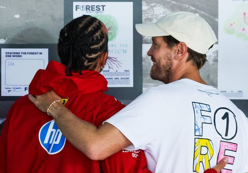 Lewis Hamilton and Sebastian Vettel stand side by side at the 2025 Brazilian Grand Prix