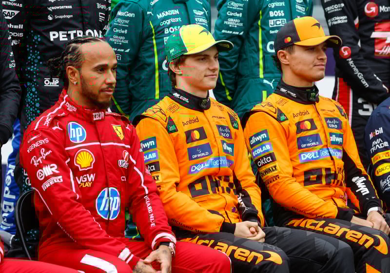 Lewis Hamilton, Oscar Piastri, Lando Norris sit next to each other at the Australian Grand Prix