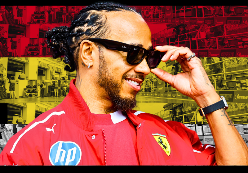 Lewis Hamilton smiling in Ferrari kit with a Belgian-themed background