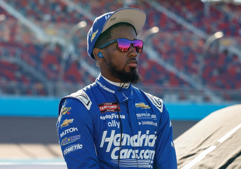An image of NASCAR driver Rajah Caruth in Hendrickcars.com gear