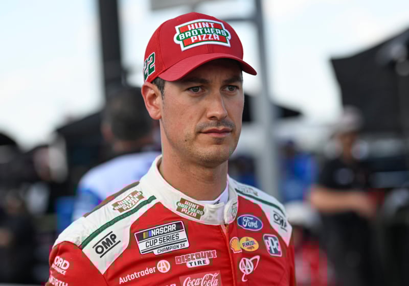 An image of NASCAR Cup Series driver Joey Logano staring into the distance