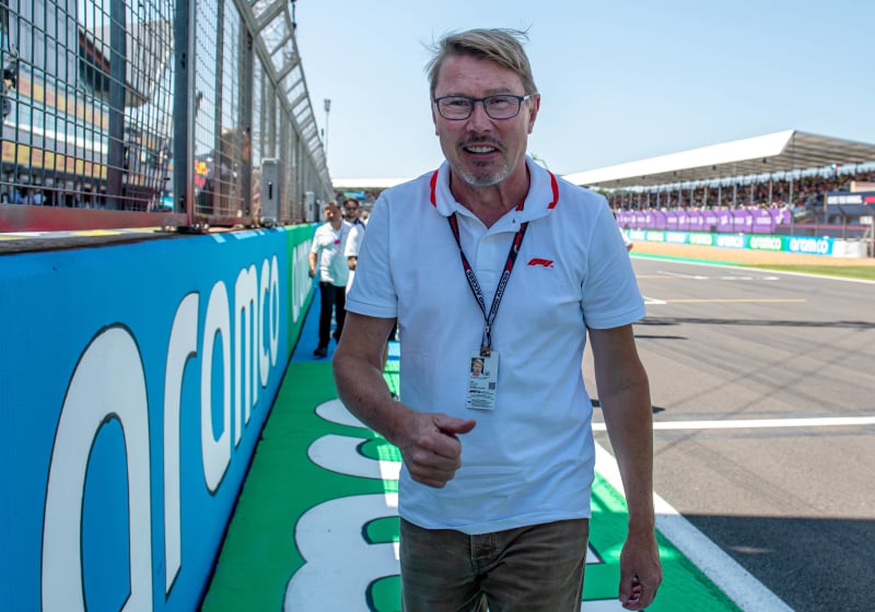 Mika Hakkinen walks around the paddock at the British Grand Prix