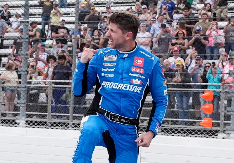 An image of Denny Hamlin celebrating a NASCAR victory