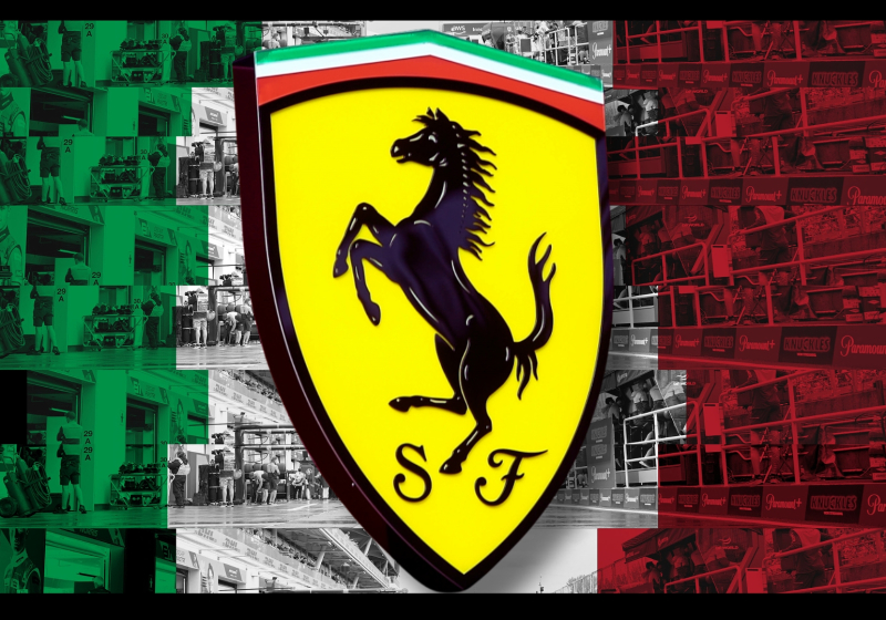 Italian flag-themed paddock background with the Ferrari logo in front