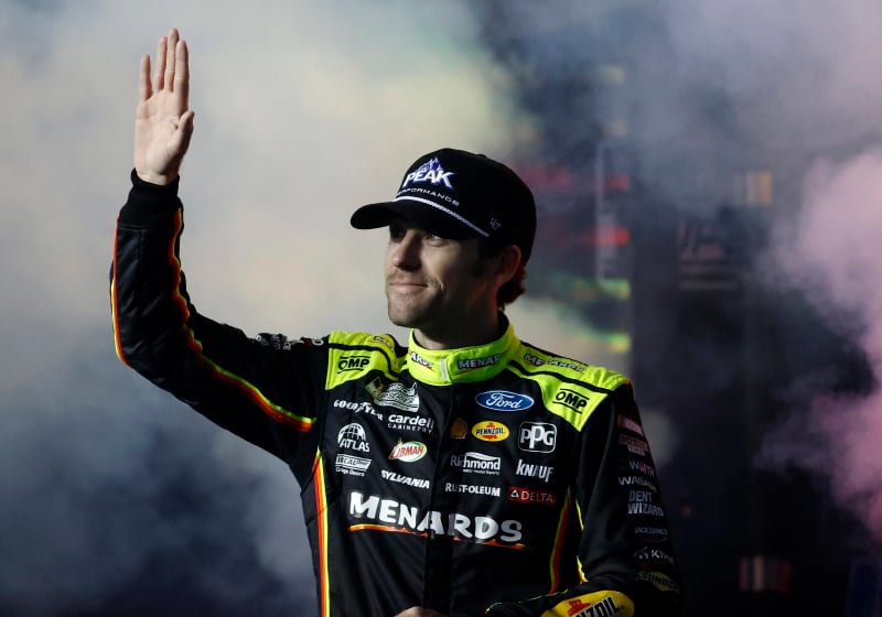 An image of NASCAR driver Ryan Blaney waving to the crowd at Daytona