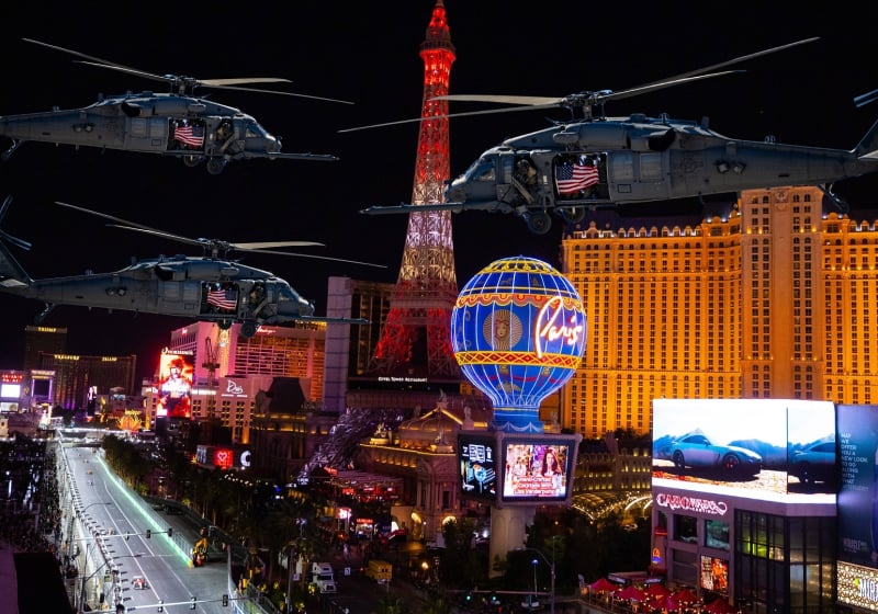 Three helicopters fly over the Las Vegas Strip during the grand prix weekend