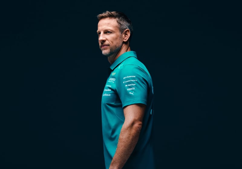 Jenson Button is pictured in Aston Martin teamwear after joining as an ambassador