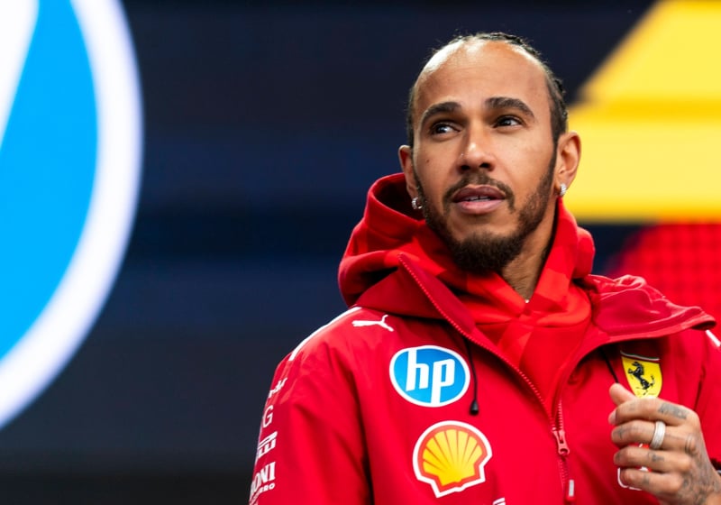 Lewis Hamilton looks off into the distance