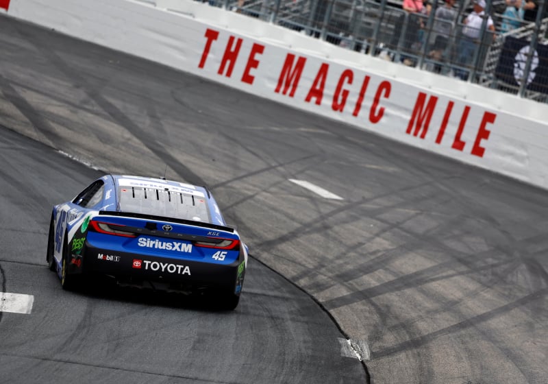An image of NASCAR Cup Series driver Tyler Reddick driving at New Hampshire Motor Speedway