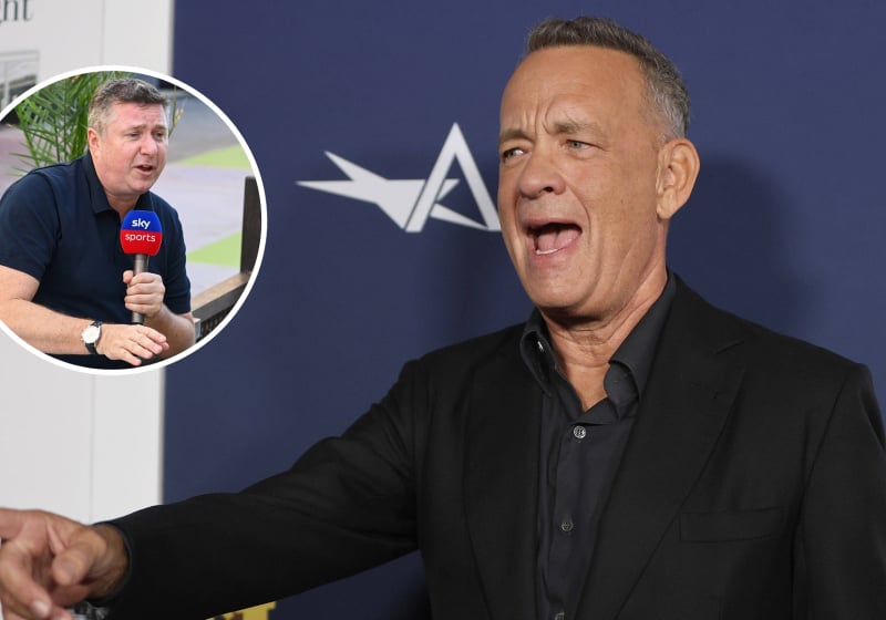 Tom Hanks looks stunned as he points to an inset photo of Sky F1 commentator David Croft