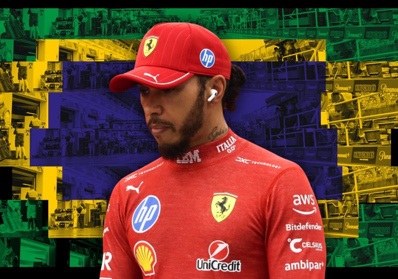 A dejected looking Hamilton in Ferrari race suit and cap in front of a Brazilian-flag themed paddock background