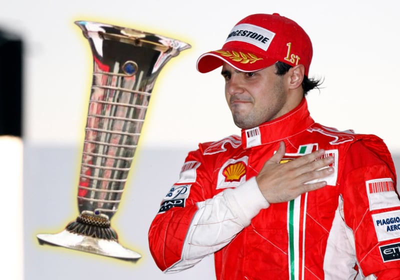 Felipe Massa beats his chest next to a composite of F1's drivers title trophy